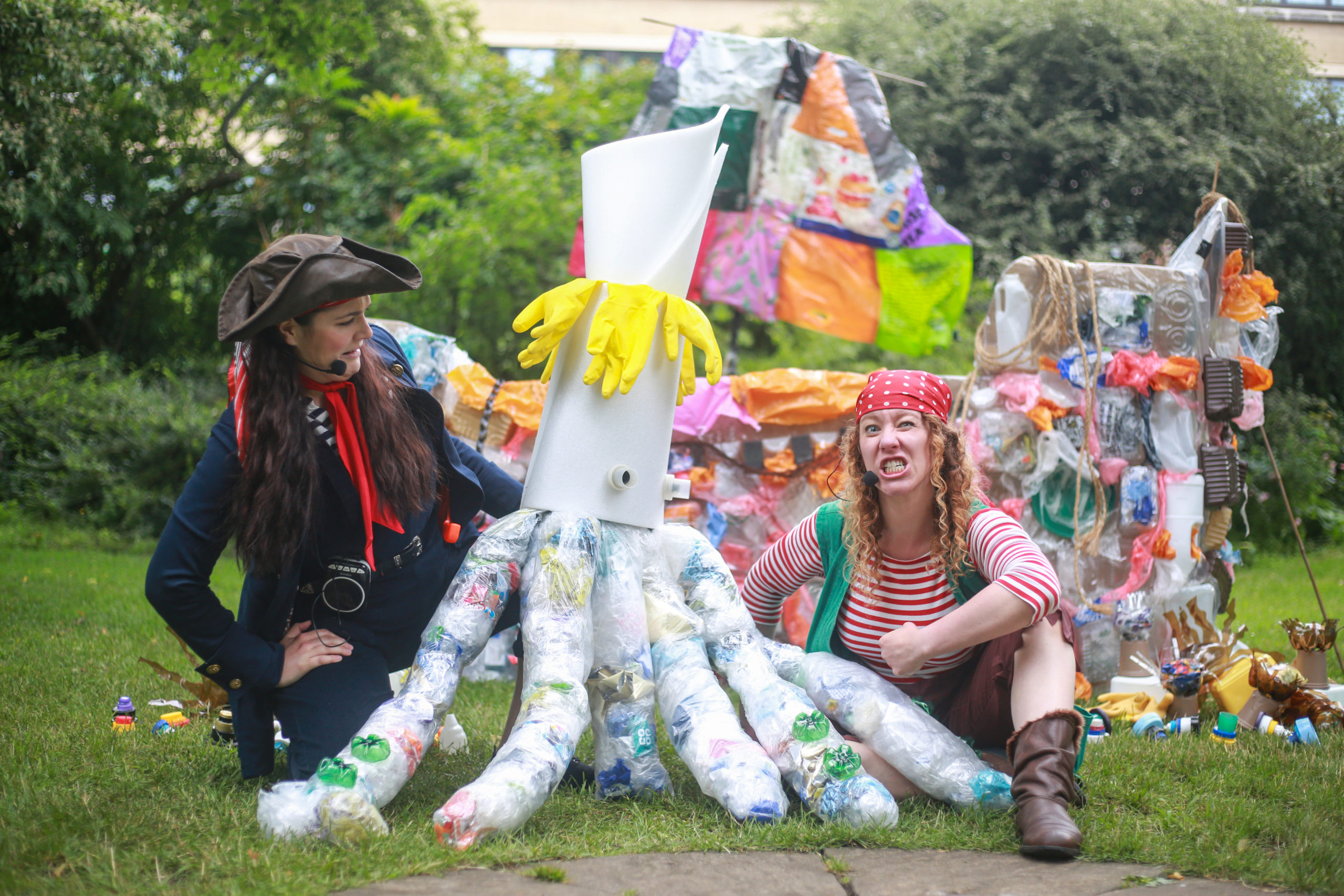 Image of a production with two pirates working with an octopus made out of recycled plastic.