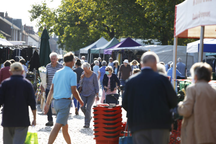 Photo of people in Thame during market day.