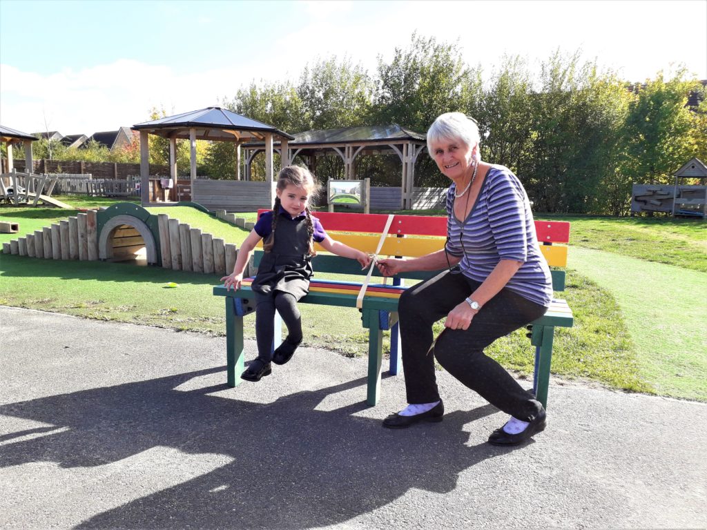 Phoenix from Didcot Primary Academy is presented with the new bench by Cllr Sue Cooper