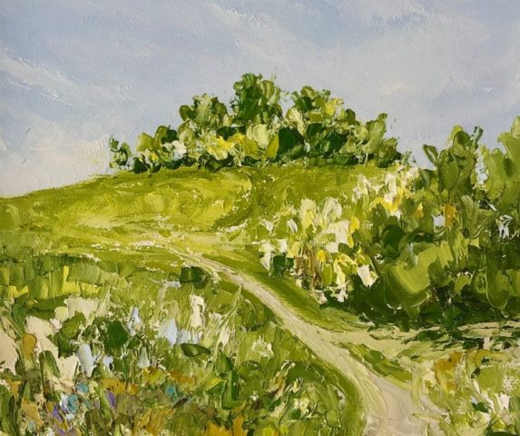 Image by the artist Janine Philips of a grassy, green landscape with a pale blue sky